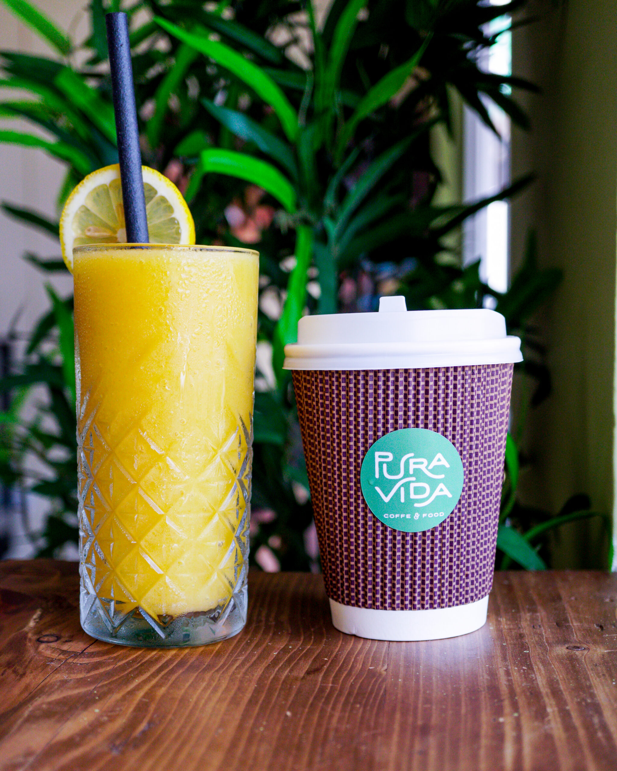 Pura Vida branded takeaway coffee cup